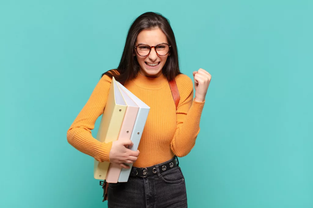 young-pretty-woman-feeling-shocked-excited-and-happy-laughing-and-celebrating-success-saying-wow-stu